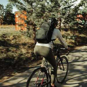 CIVIC Half Zip 22l in Solution Dyed Black - worn while biking