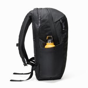 CIVIC Half Zip 26l in Solution Dyed Black - side view with water bottle