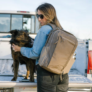 CIVIC Travel Bag 20L in Fossil Brown - side carry by truck