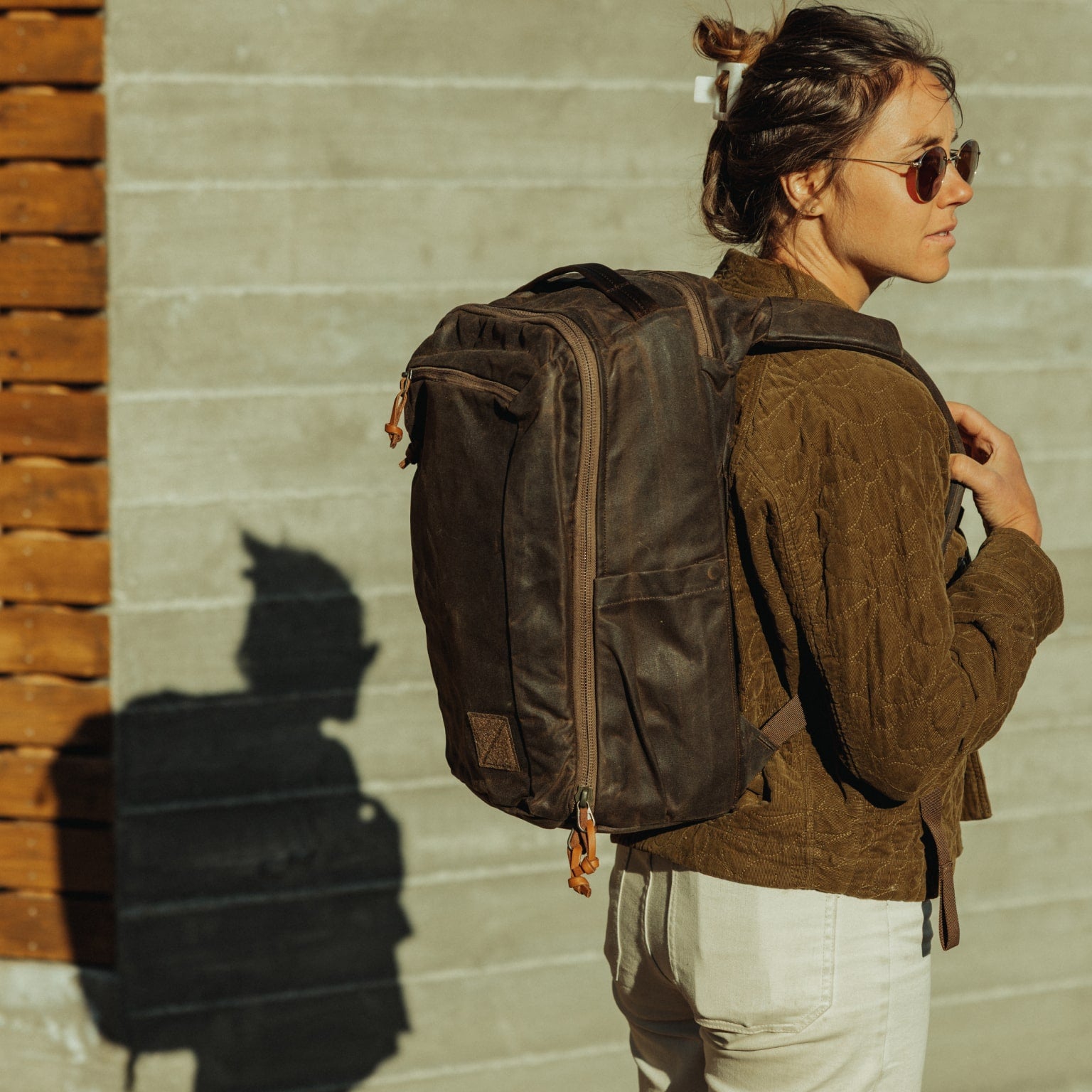 CIVIC Travel Bag 20L in Waxed Canvas - Waxed Tan - quarter profile worn CIVIC Travel Bag 20L in Waxed Canvas - Waxed Tan - quarter profile worn [13019cc-WTN