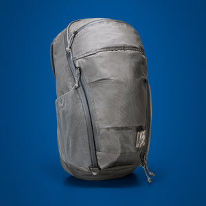 MOUNTAIN Panel Loader 22L in Gravel Gray - Ultra - Front quarter view on blue background