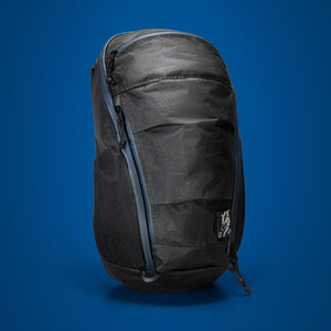 MOUNTAIN Panel Loader 22L in Black Magic. Front of pack on blue background