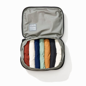 Transit Packing Cube 10L in Black - packed with 12 t-shirts