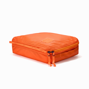 Transit Packing Cube 10L in Hot Orange - packed, full, and flat