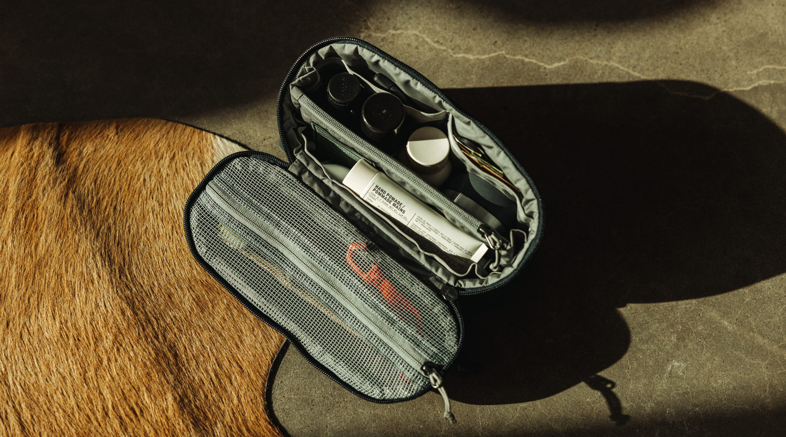 Dark Navy Konbu CIVIC Access Pouch 2L as a toiletry pouch