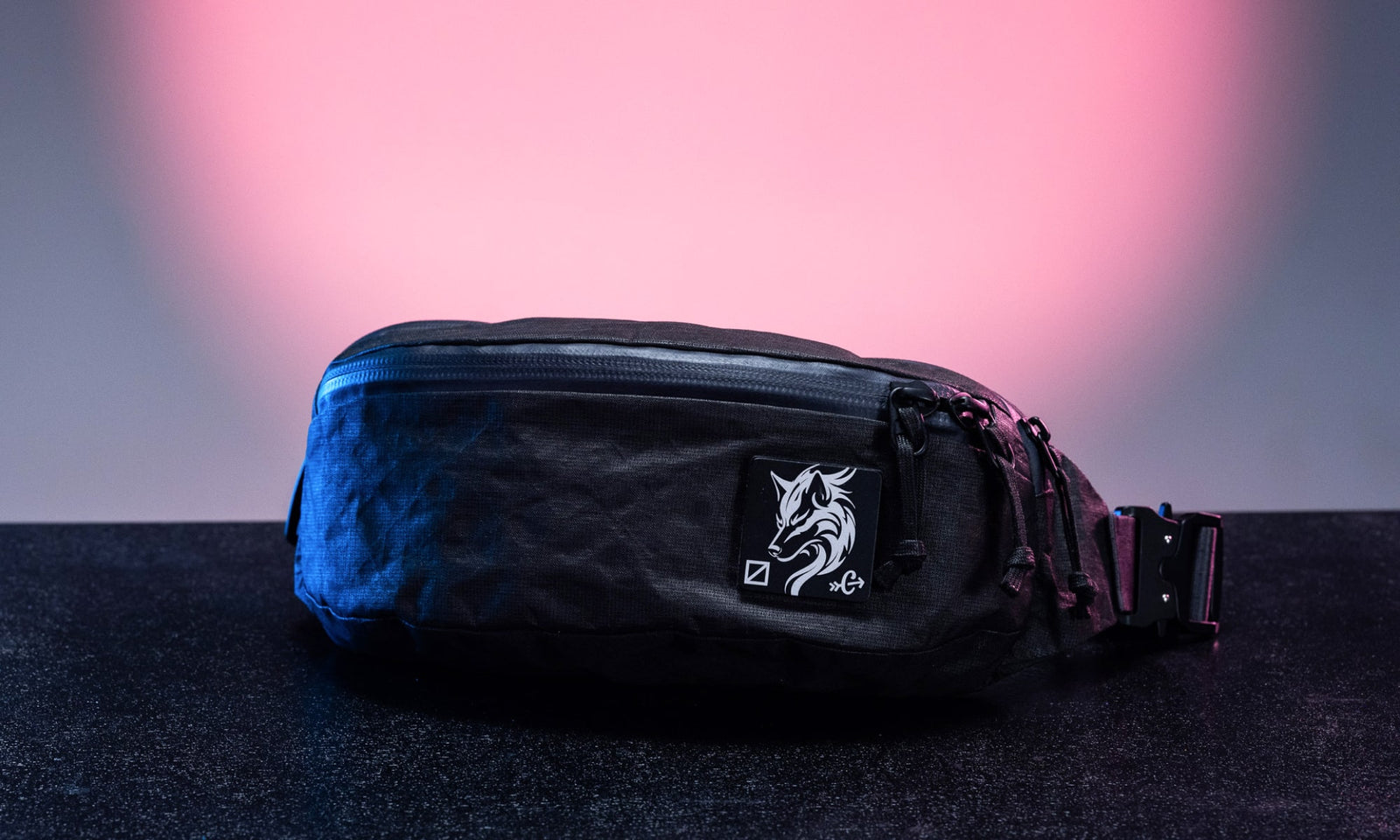 CIVIC Access Sling 2L - Kludde Edition in Black Magic - sitting on a table