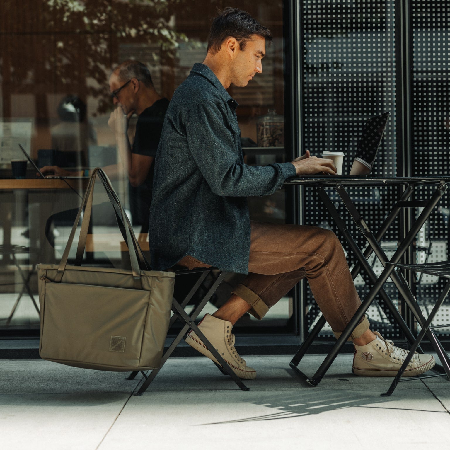 CIVIC Daily Tote 24L in OD Green - CDT24 - hanging next to desk while working remotely [13024a-ODG]