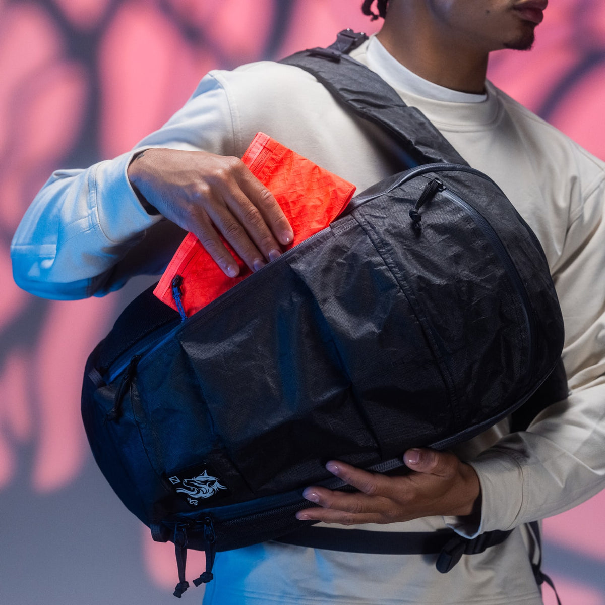 CIVIC Flat Pouch - CFP - in Electric Coral - Stowed in front side-access pocket of backpack