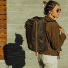 CIVIC Travel Bag 20L in Waxed Canvas - Waxed Tan - quarter profile worn CIVIC Travel Bag 20L in Waxed Canvas - Waxed Tan - quarter profile worn [13019cc-WTN