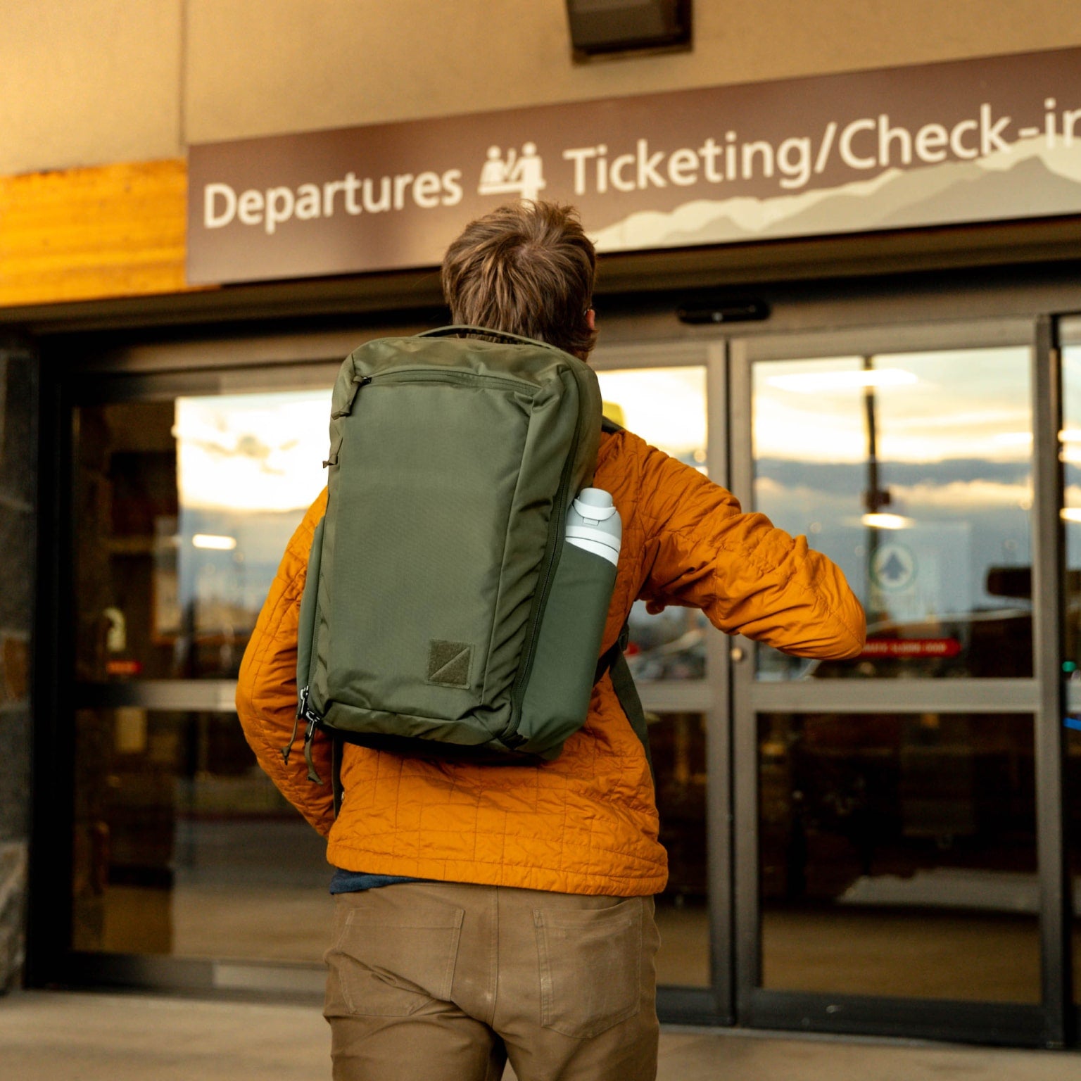 CIVIC Travel Bag 26L in OD Green at the airport for travel [13012c-ODG]
