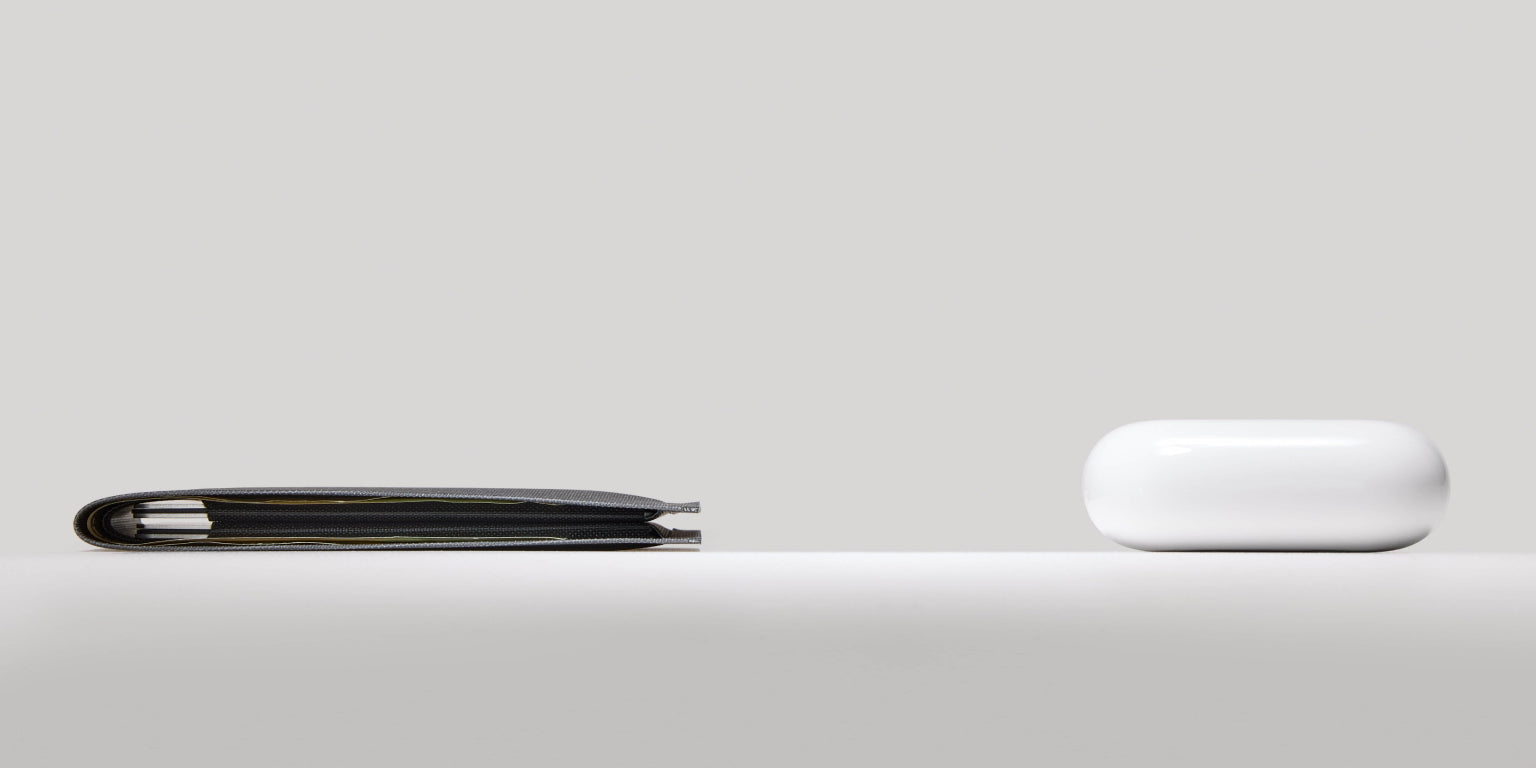 element bifold wallet in solution dyed black size compared to airpods