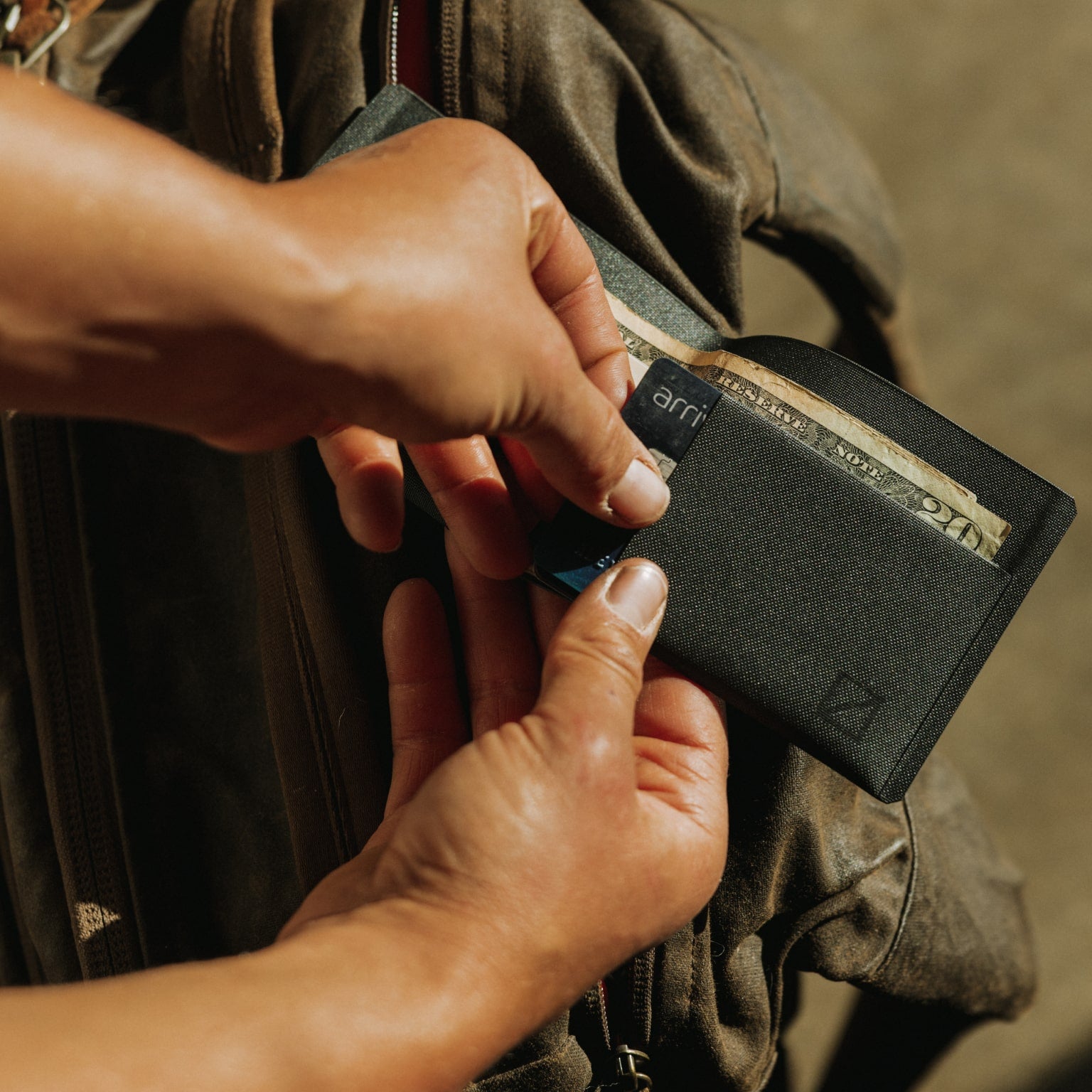 ELEMENT Bifold Wallet - EBW - Solution Dyed Black - lifestyle -pulling card out