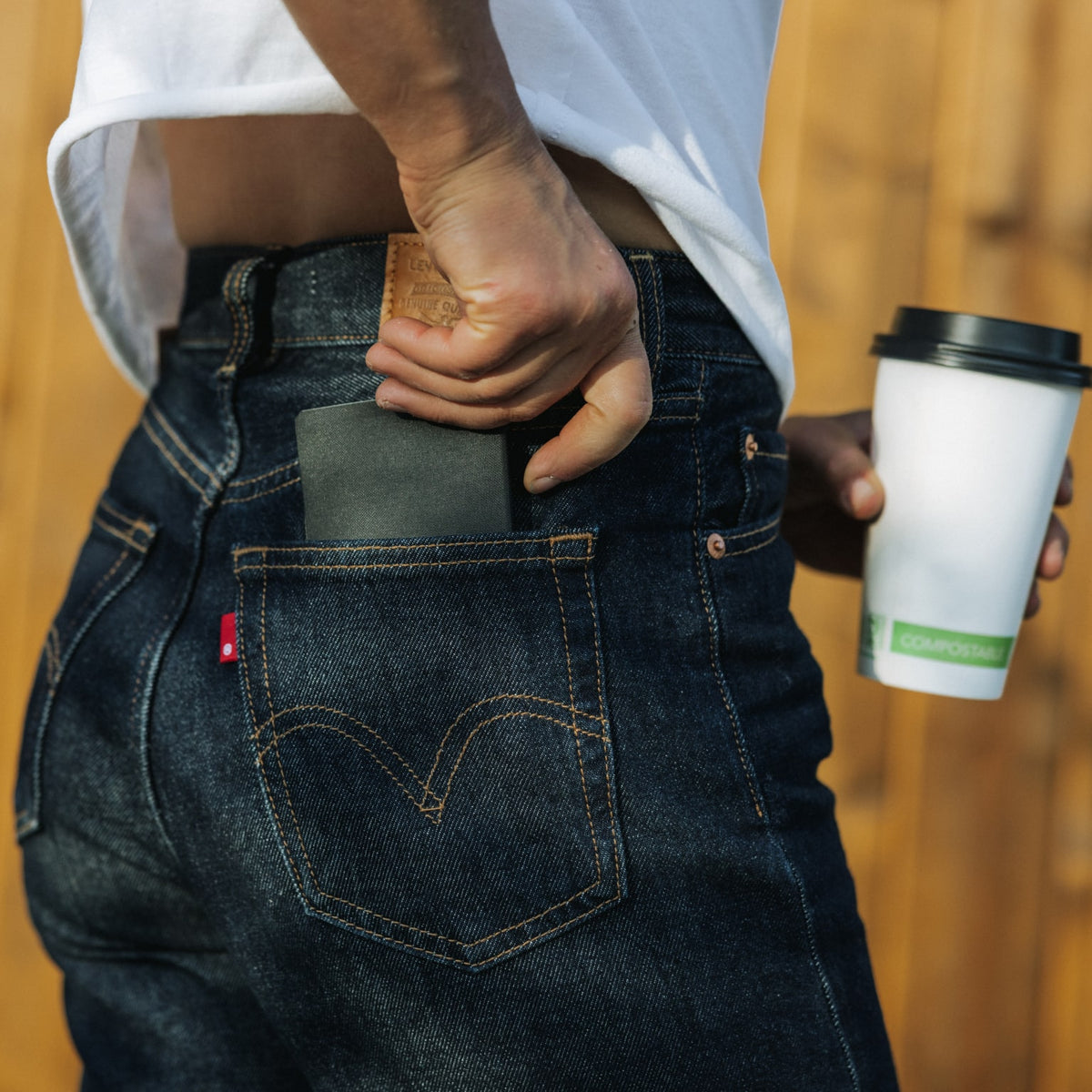 ELEMENT Bifold Wallet - EBW - Solution Dyed Black - lifestyle - pulling wallet out of jeans back pocket