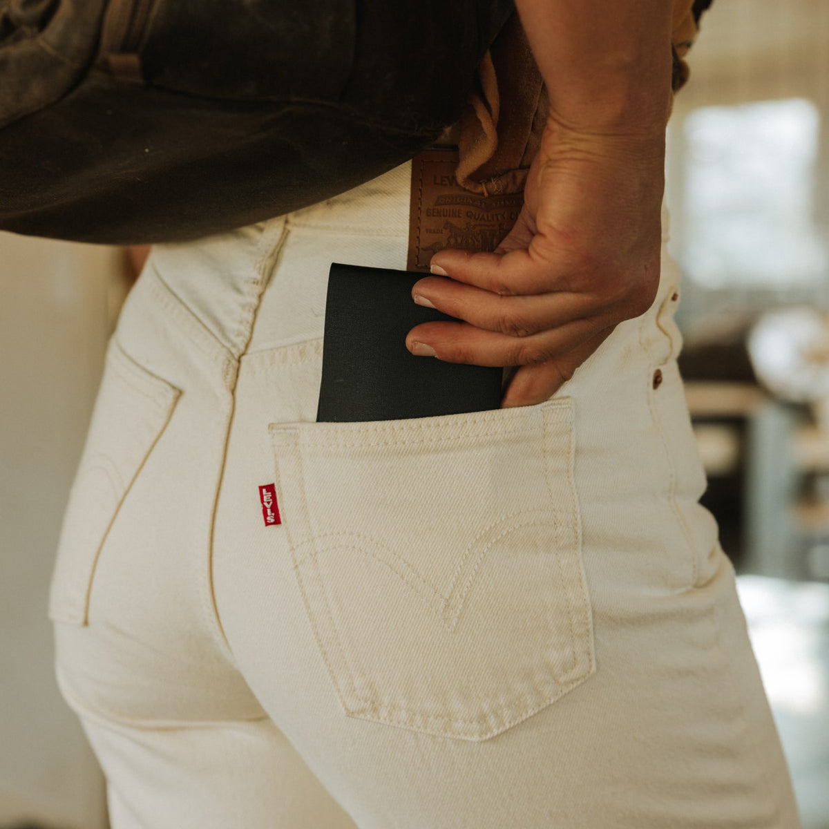 ELEMENT Bifold Wallet - EBW - Solution Dyed Black - lifestyle - pulling wallet out of pocket