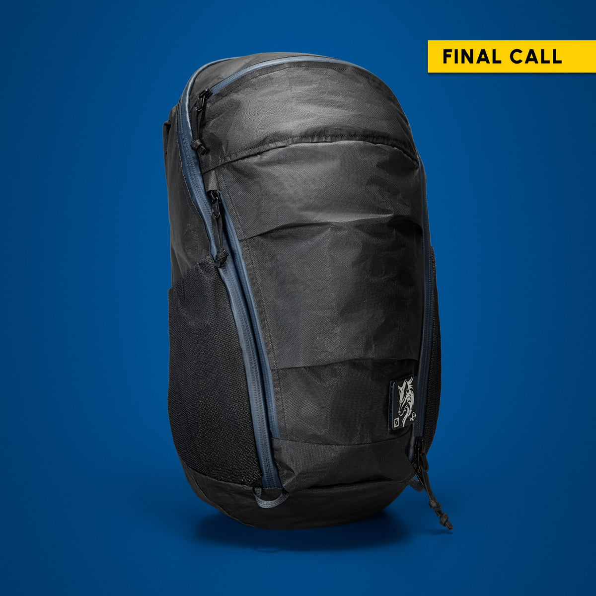 MOUNTAIN Panel Loader 22L in Black Magic. Front of pack on blue background