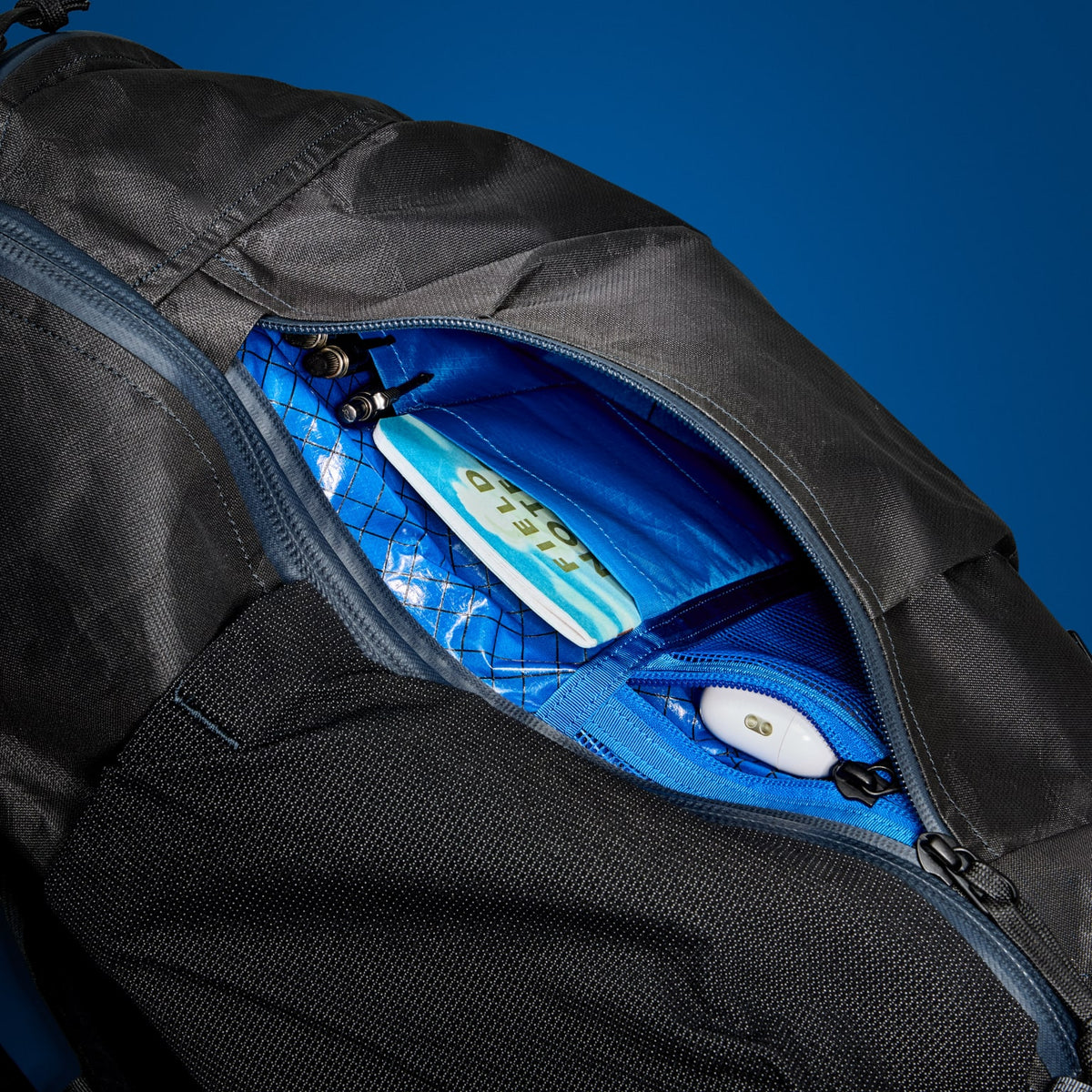MOUNTAIN Panel Loader 22L in Black Magic - Ultra - Blue Flame internal lining side-access pocket with drop-in organization