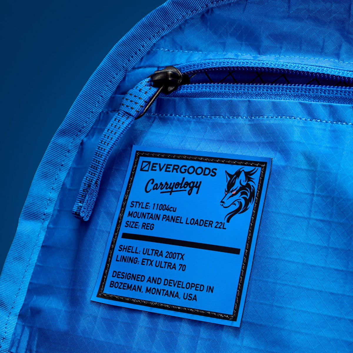 MOUNTAIN Panel Loader 22L in Black Magic - Ultra - Blue Flame lining, style labe