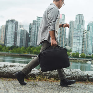 Transit Briefcase 20L - Solution Dyed Black - handle in motion