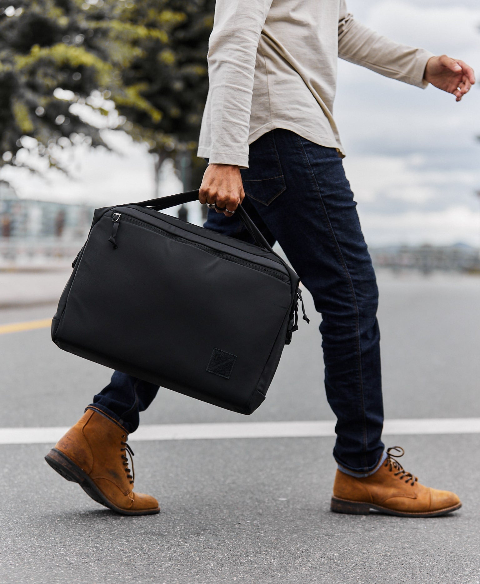 Transit Briefcase 20L - Solution Dyed Black - curved handles in use