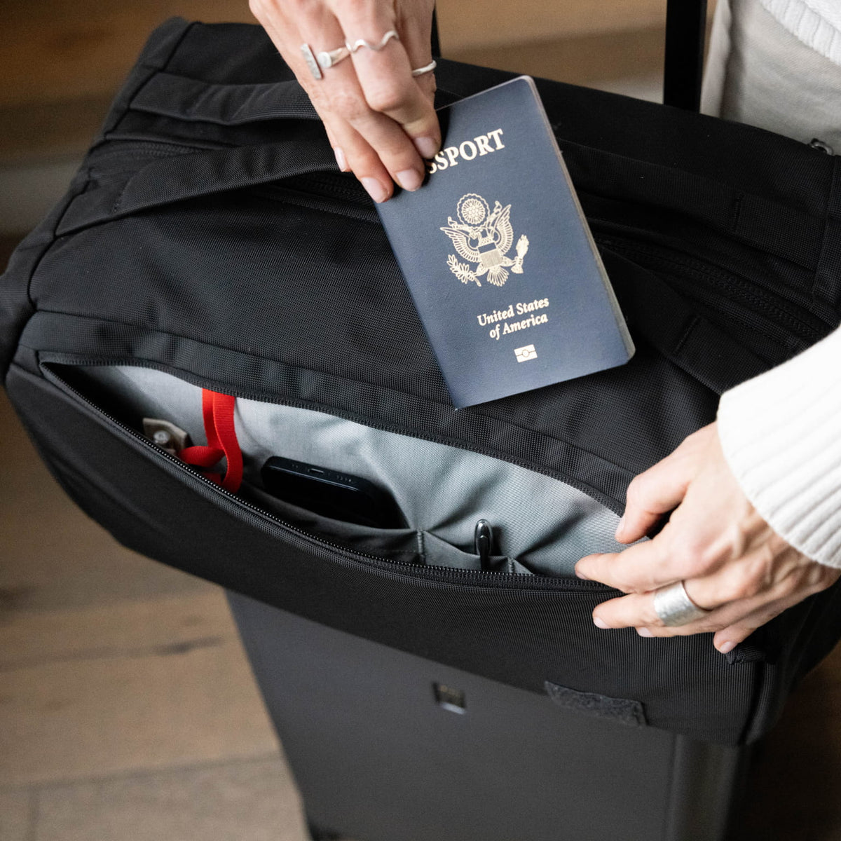 Transit Duffel 25L in Solution Dyed Black - exterior drop in pockets