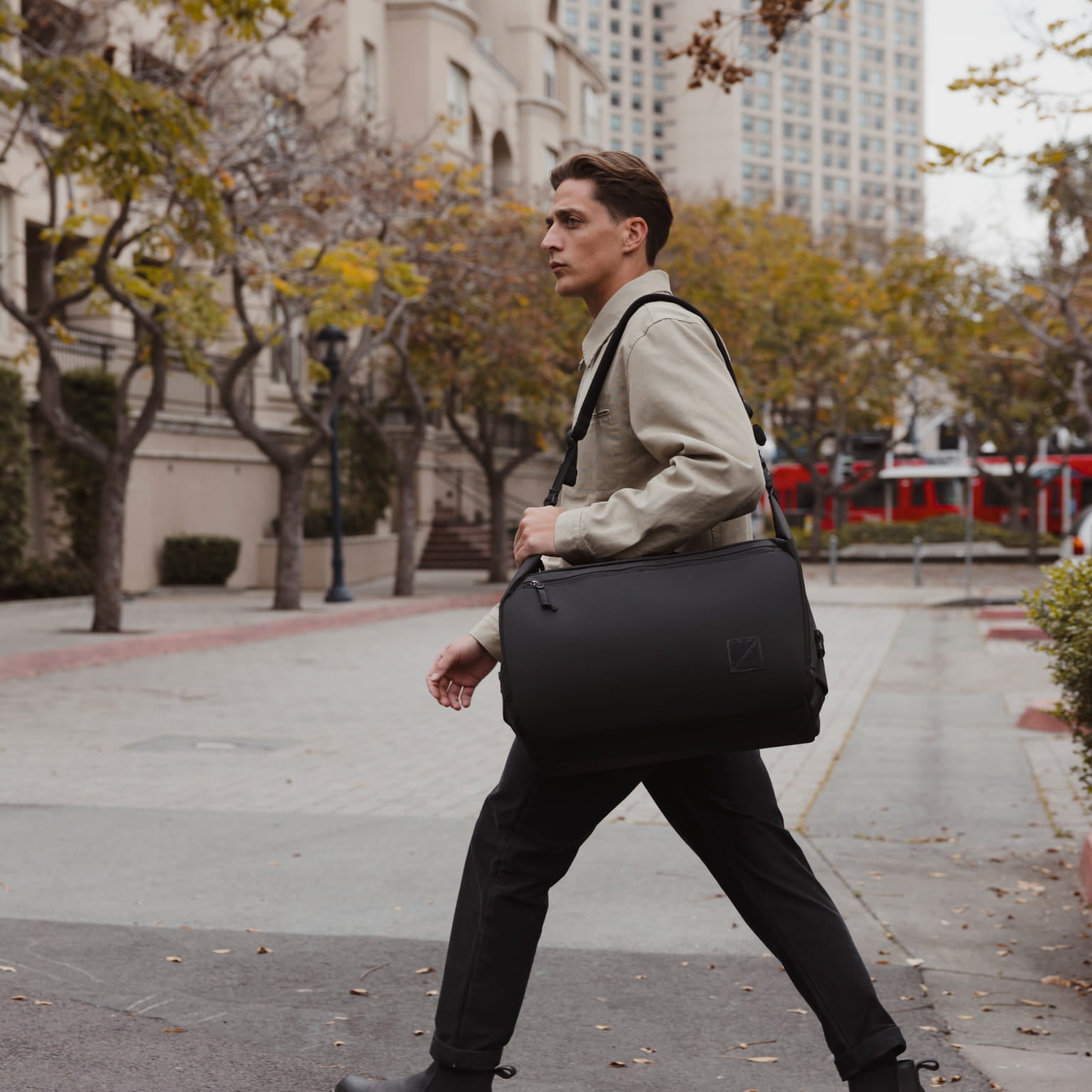 Transit Duffel 35L in Solution Dyed Black - over shoulder strap carry [13014d-SBK]