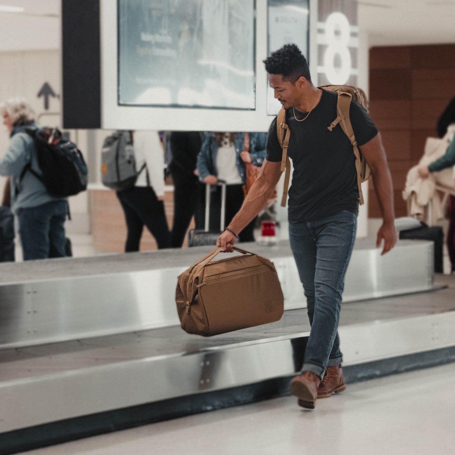 Transit Duffel 35L in Coyote Brown at baggage claim