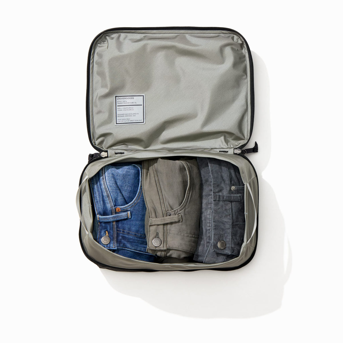 Transit Packing Cube 10L in Black - packed with 3 pairs of pants