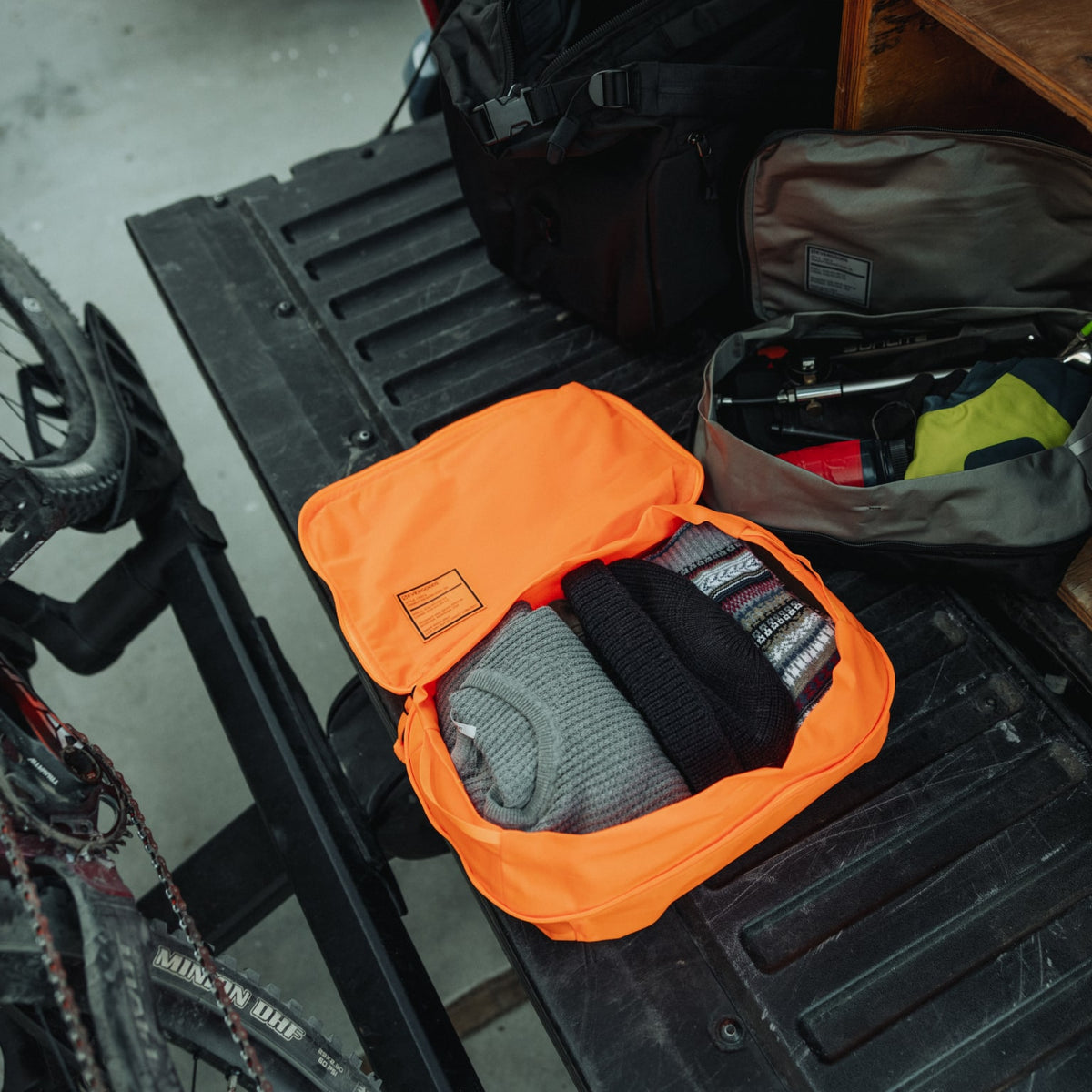 Transit Packing Cube 10L in Hot Orange - packed, wide open, and flat