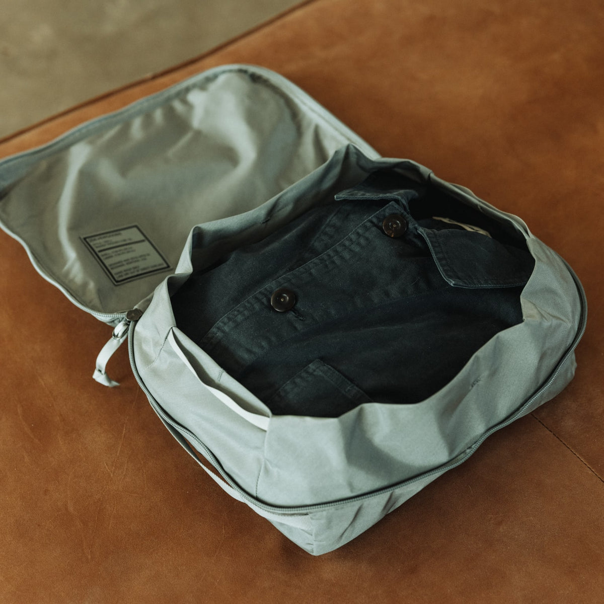 Transit Packing Cube 10L in Standard Gray - packed compression cinch collar