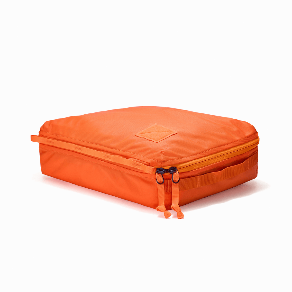 Transit Packing Cube 10L in Hot Orange - packed, full, and flat