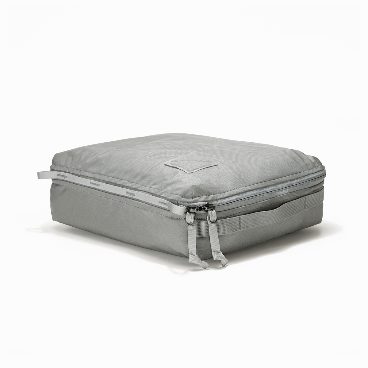 Transit Packing Cube 10L in Standard Gray - packed and laid flat