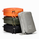 Transit Packing Cube 4L, stack of four cubes in Hot Orange, OD Green, Black, and Standard Gray Transit Packing Cube 4L, stack of four cubes in Hot Orange, OD Green, Black, and Standard Gray [13026a-BLK, 13026a-HTO, 13026a-ODG, 13026a-STG
