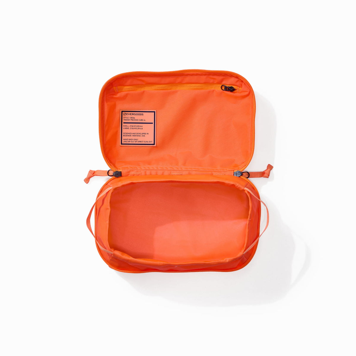 Transit Packing Cube 4L in Hot Orange - open and unpacked