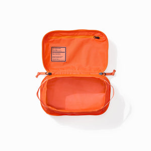 Transit Packing Cube 4L in Hot Orange - open and unpacked