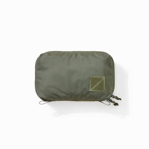 Transit Packing Cube 4L in OD Green - overhead and packed