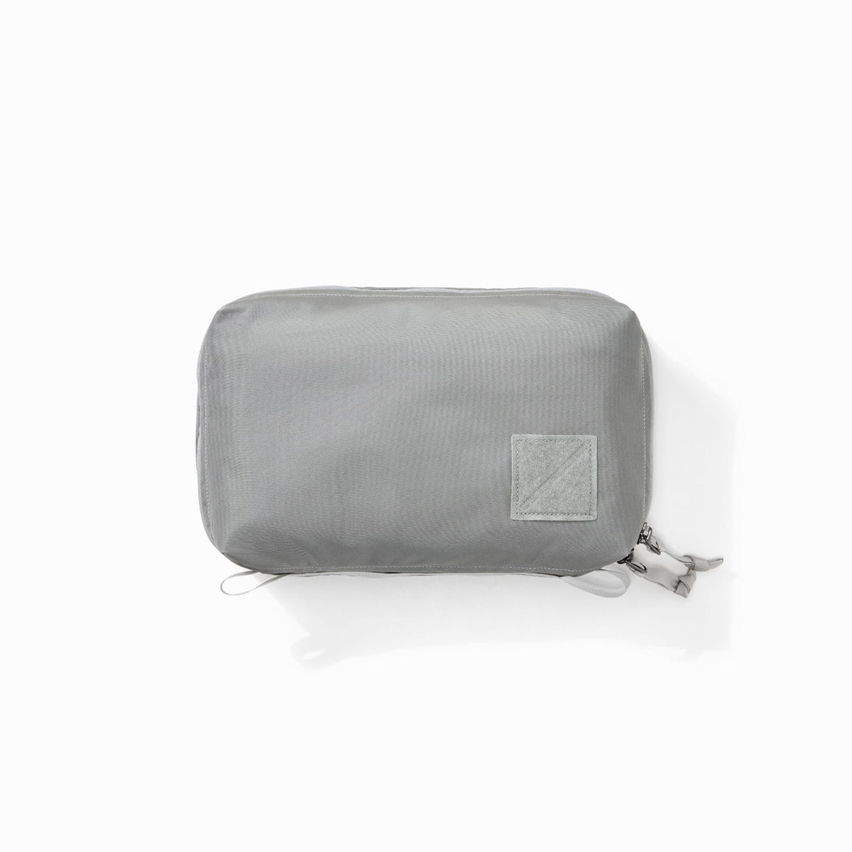 Transit Packing Cube 4L in Standard Gray - overhead image of packed cube