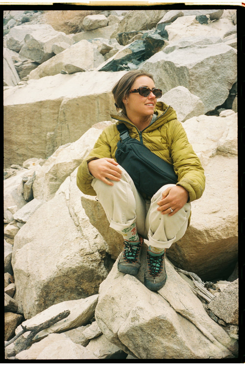 EVERGOODS Bishop Behind the Scenes Film Mountain Hip Pack relaxing on rock
